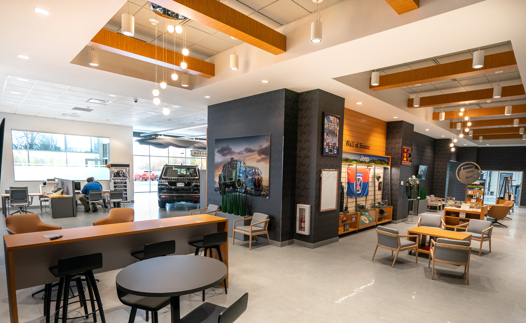 Burritt Motors dealership lounge with seating area, retail displays and wood ceiling accents